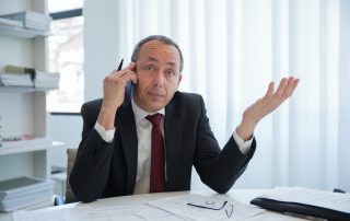Uncertain businessman on phone [Image © Kampus Production / Pexels]
